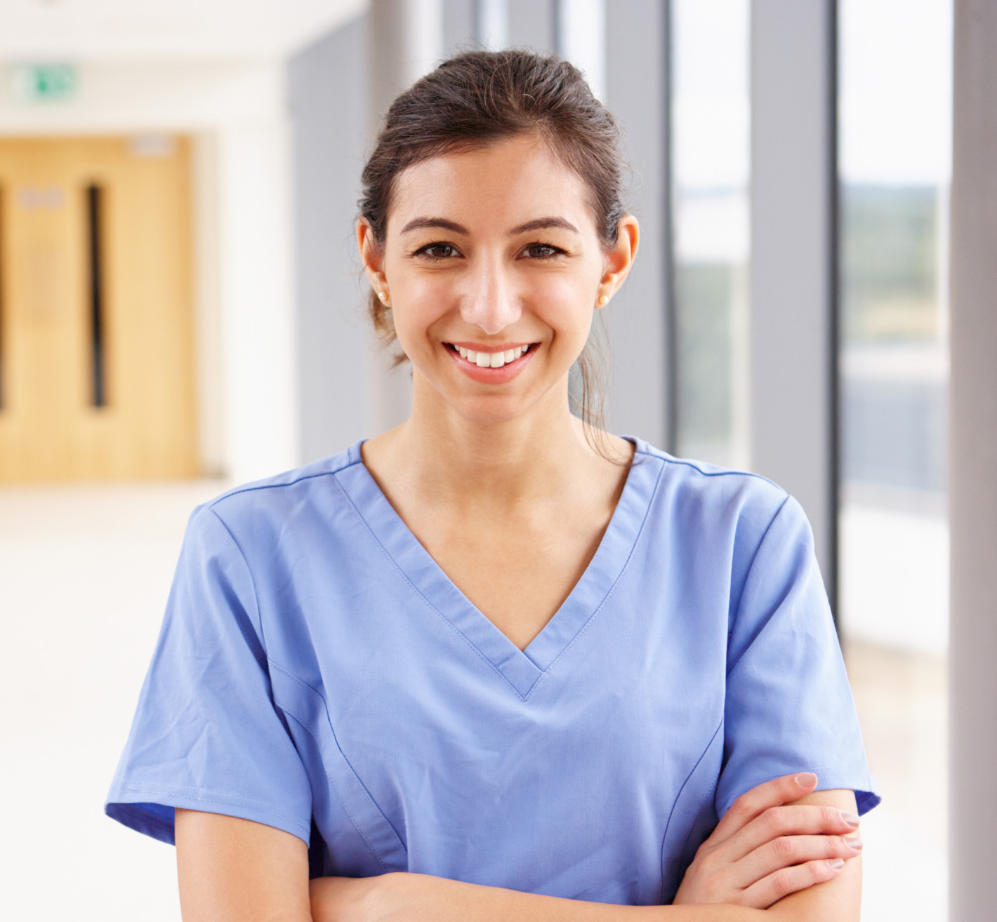 Nurse standing in hospital smiling