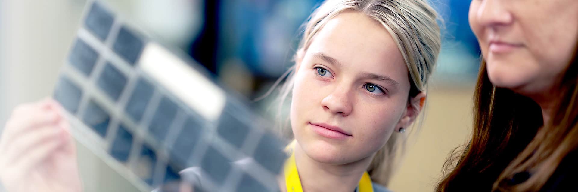 Young woman looking at x-rays.