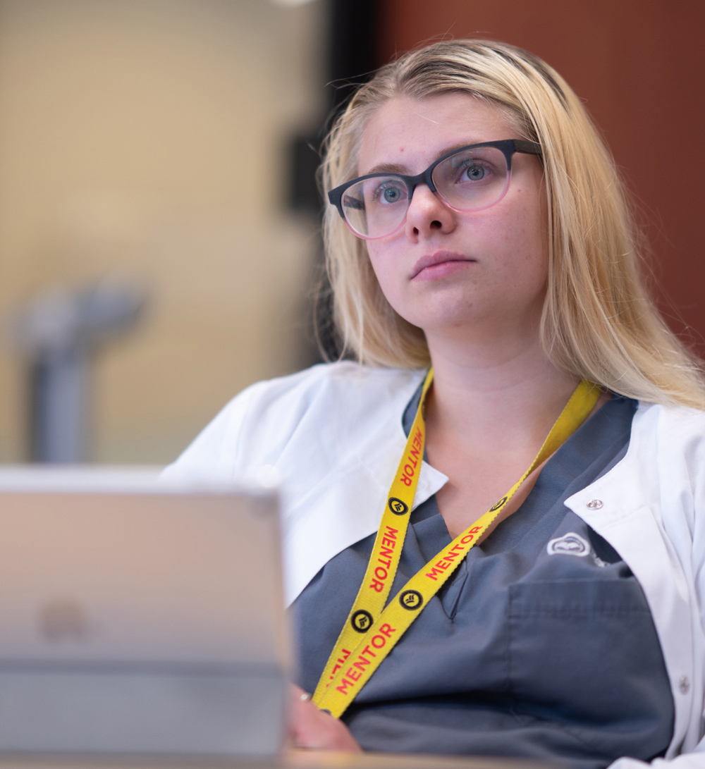 Carrington College nursing student with laptop