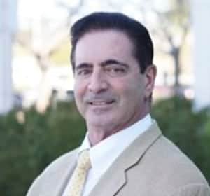 man in tan suit jacket