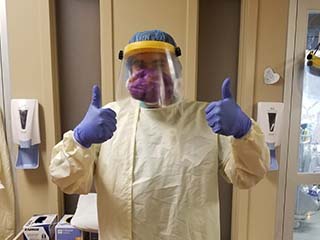 Respiratory Therapist Ismael working in the field in PPE