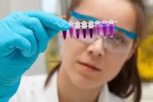 medical-lab-tech-examining-test-tubes medical-lab-tech-examining-test-tubes