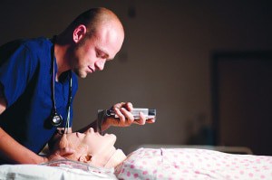 Carrington College Respiratory Care student working in lab