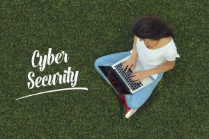 woman-on-computer-sitting-in-grass