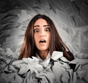 worried-woman-surrounded-by-papers